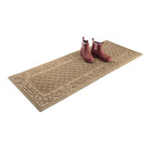 Pink rubber women's boots sitting on top of a  2'x5' Tristan WaterHog long runner mat that has a stain-resistant surface and back with incredibly durable rubber.