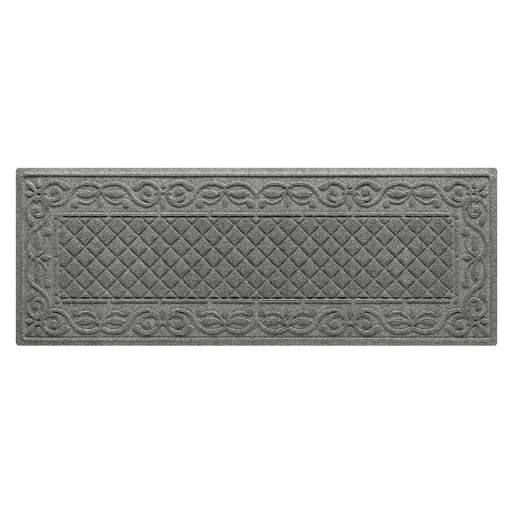 An overhead of a medium grey WaterHog Tristan modern runner in a two-part design - an ornate scroll pattern boarding the classic diamonds pattern, shown on a white background.