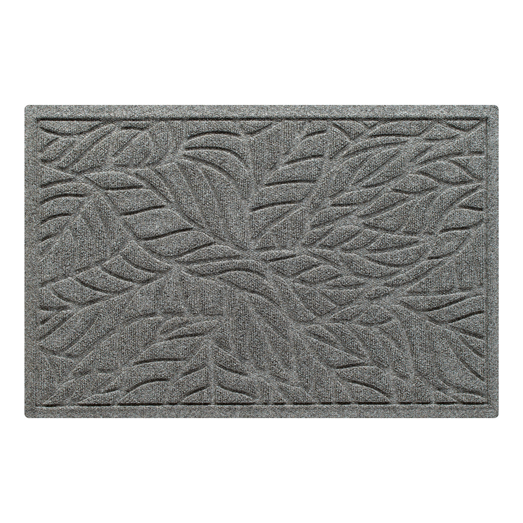 An overhead grey WaterHog single-door doormat in a bi-level tropical leaf pattern made from eco-friendly fibers and in-house rubber - all made in the USA.